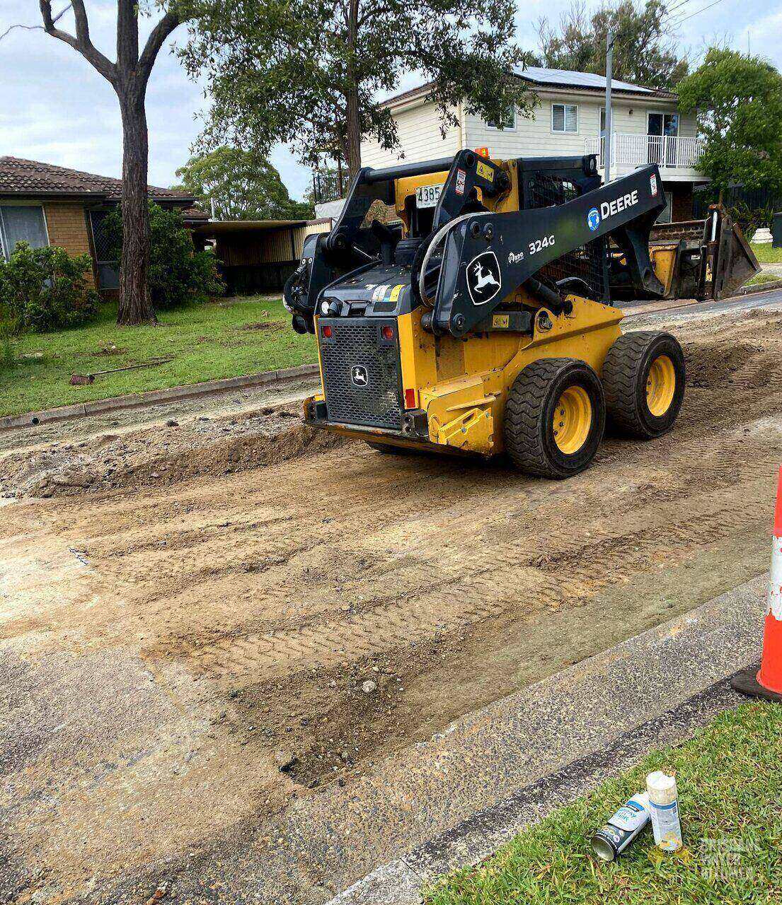 Excavated section of storm-damaged asphalt ready for repair on a Central Coast street