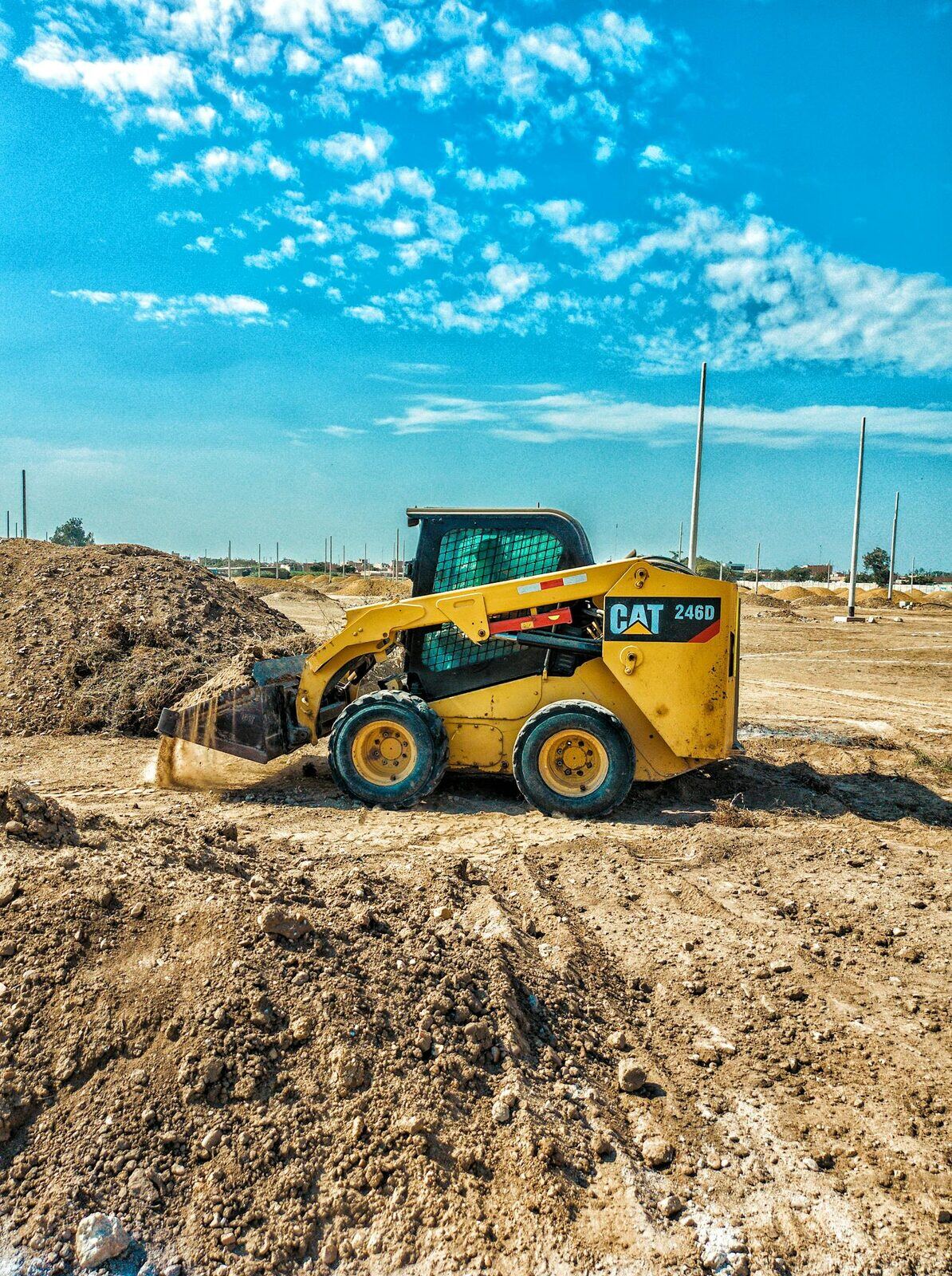 Cat 246D skid-steer on subdivision earthworks pad