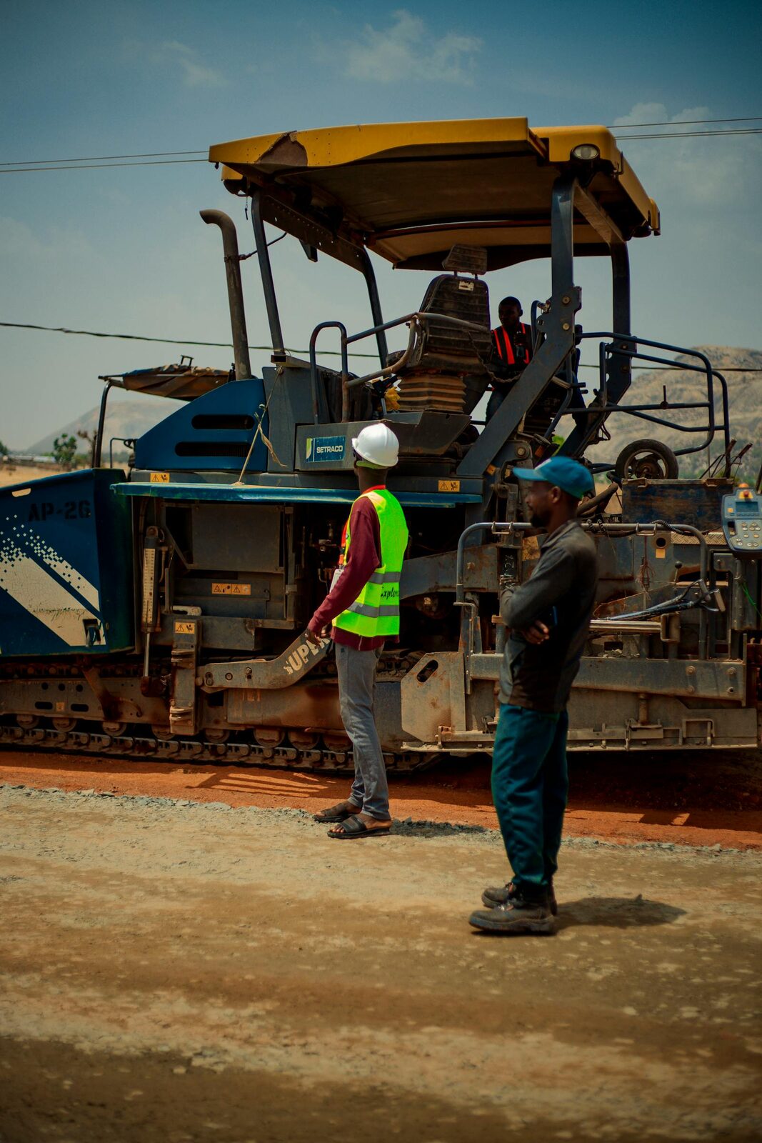 BWB-style crew working a paver on civil pavement