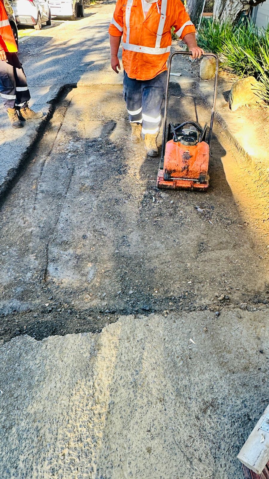 Crew prepping pavement