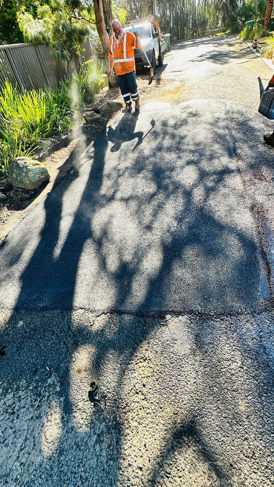 BWB crew finishing rural asphalt driveway, Central Coast